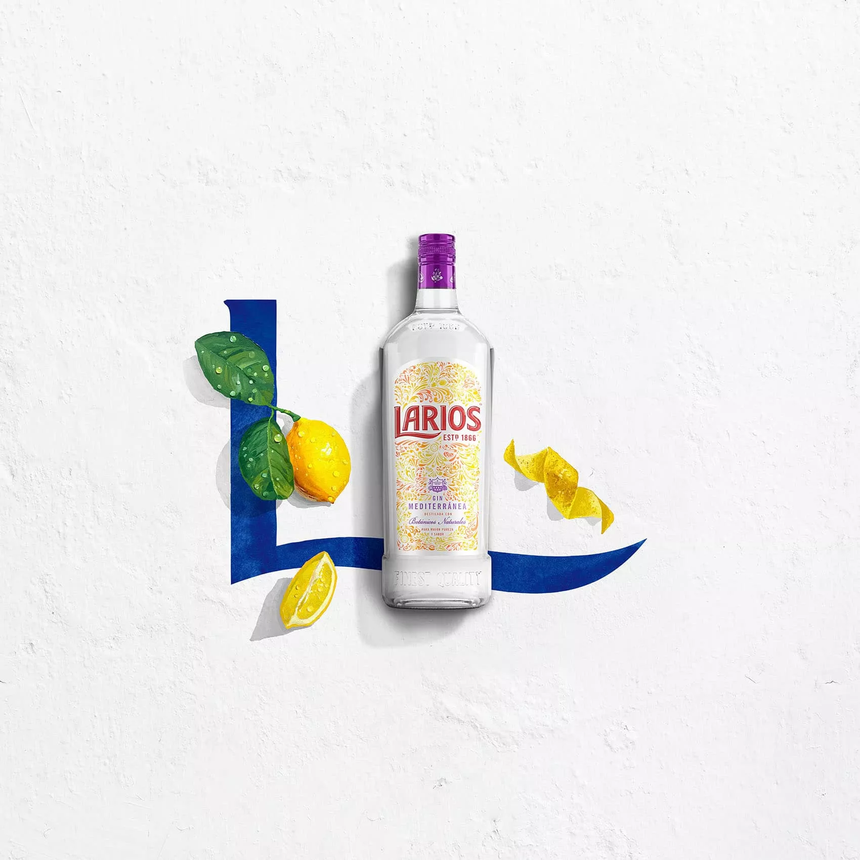 Bottle of Larios dry gin beside fresh lemon