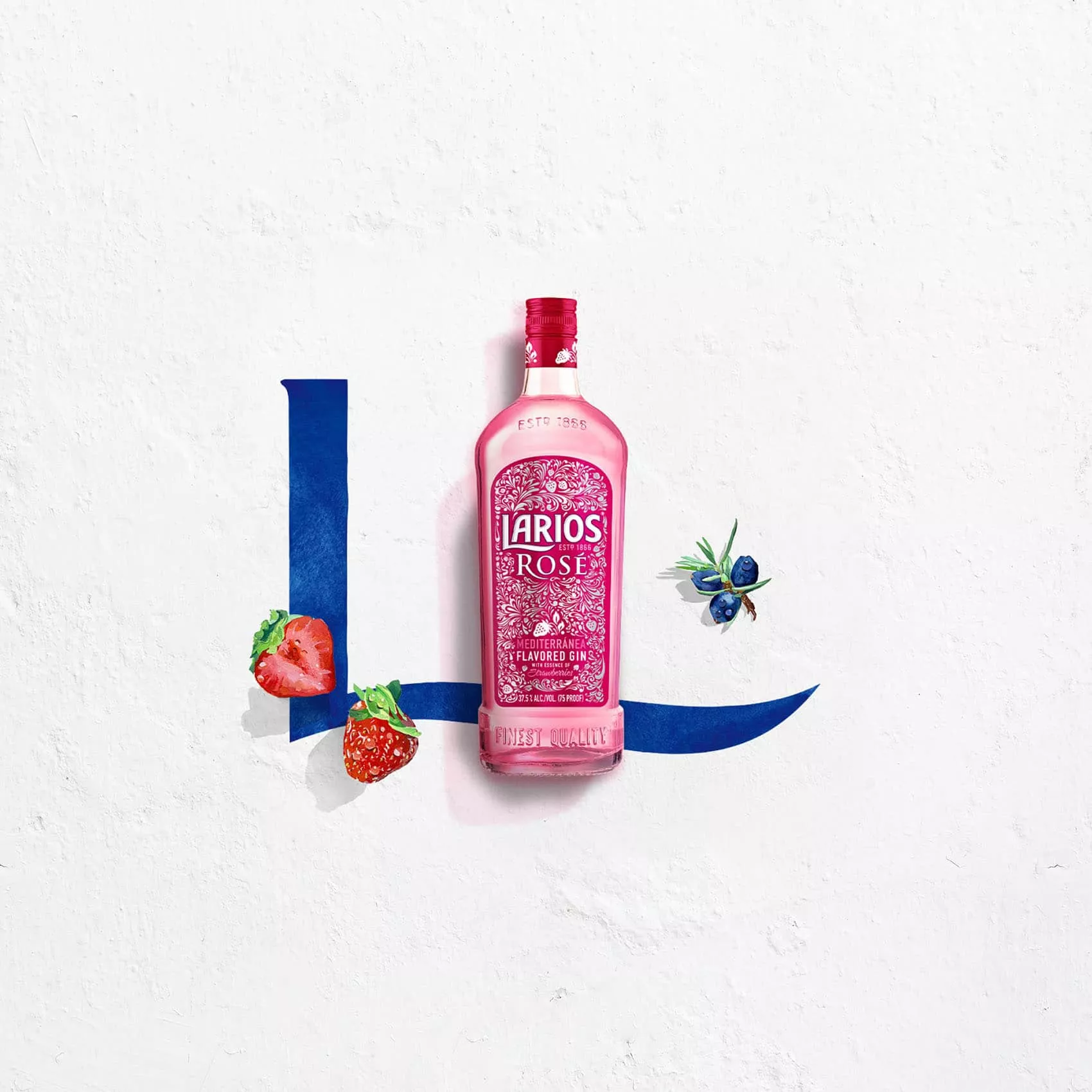 Bottle of Larios rose between strawberries and juniper berries